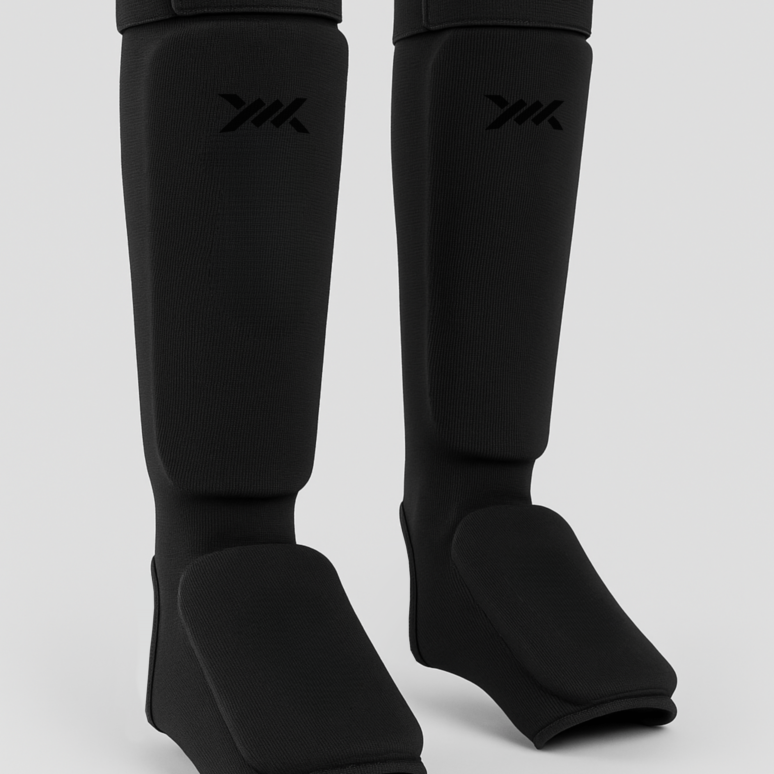 CagedCoreShinguardsAllBlack.png
