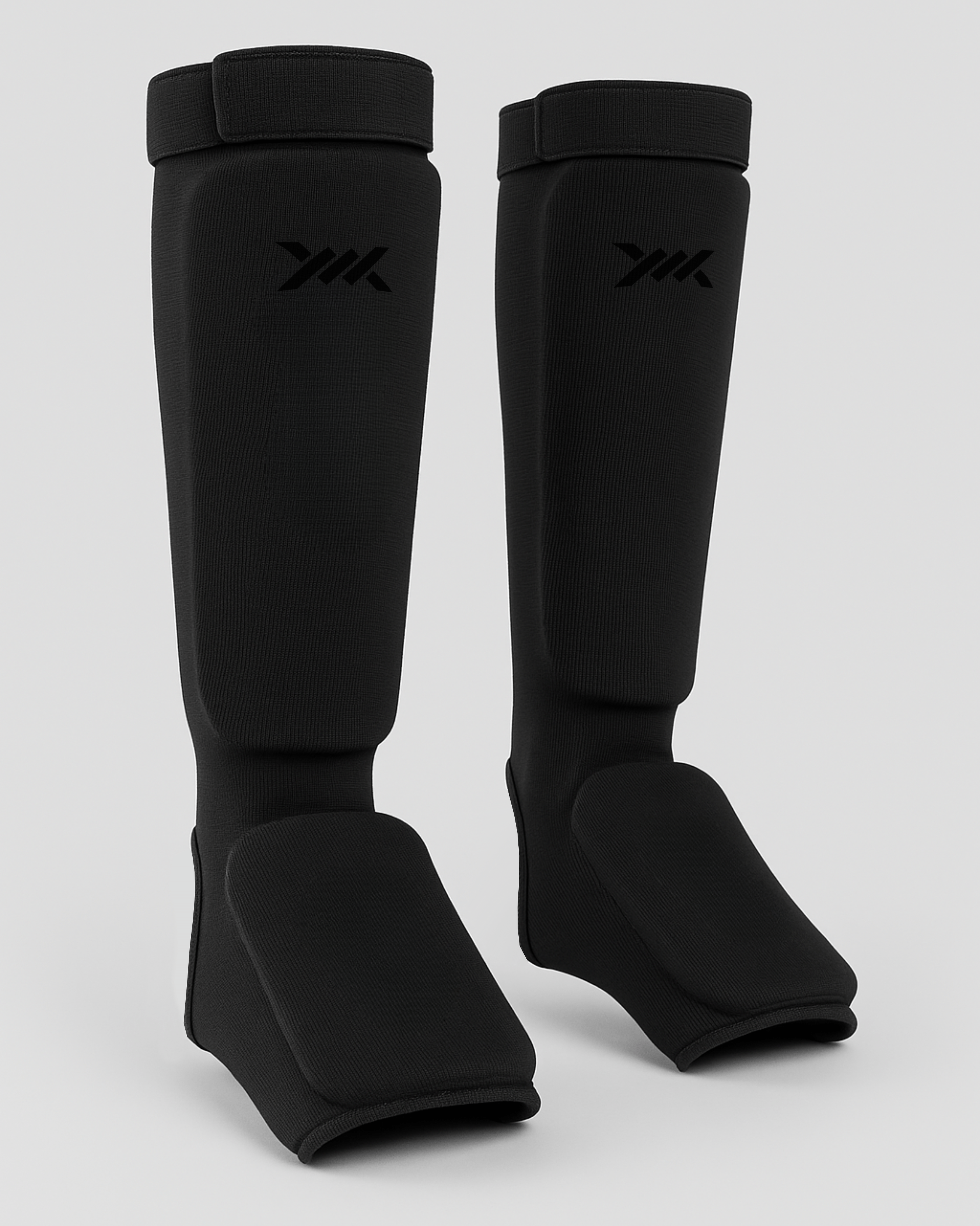 CagedCoreShinguardsAllBlack.png